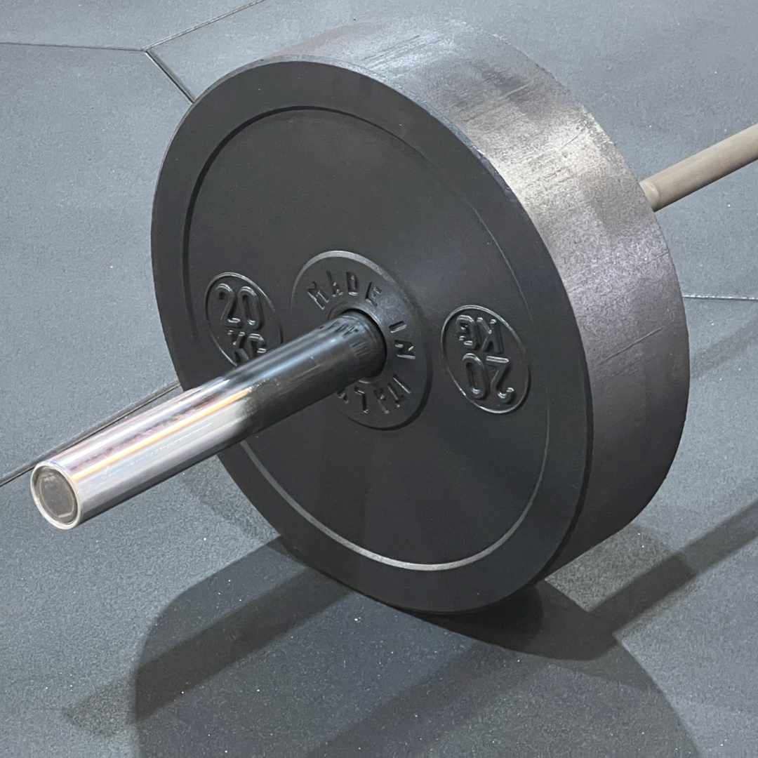 Olympic barbell with ECO-BUMPER plates on a rubberized floor