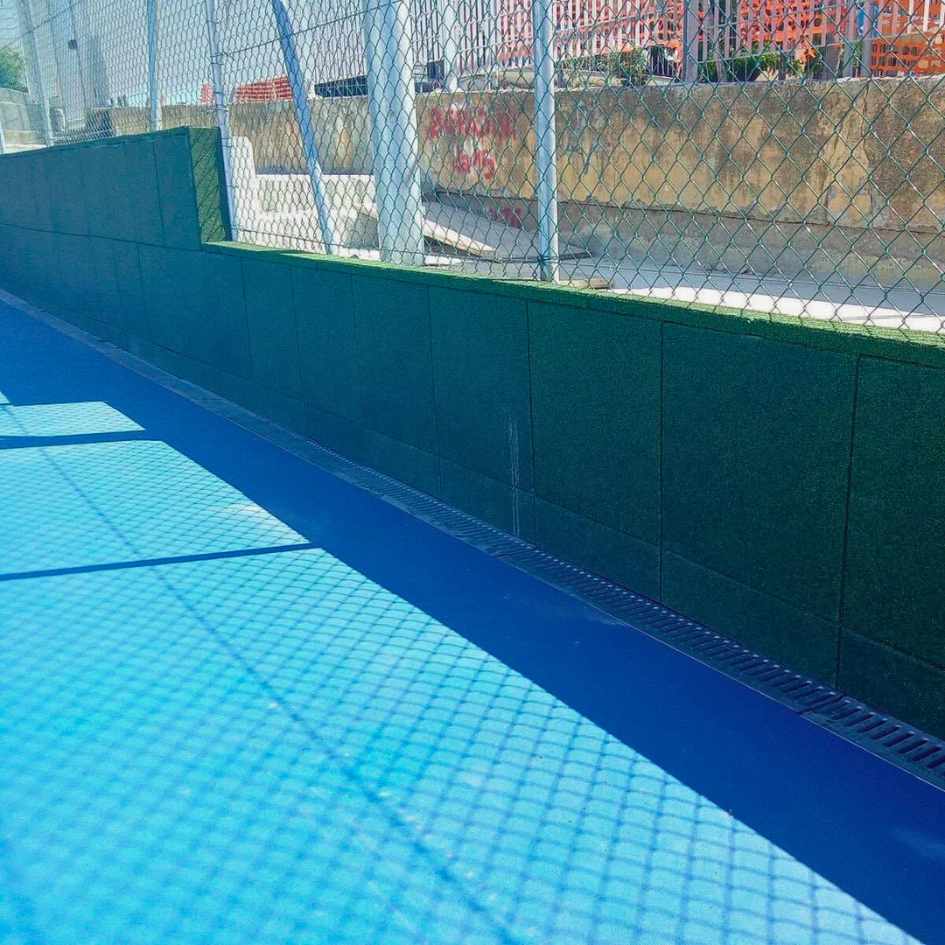 Sports field with protective rubber surfacing