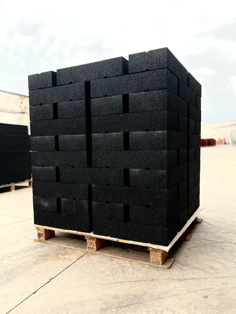 ECO-BALLAST 9 Black ECO-BALLAST ballast weights stacked on pallets for transport and storage