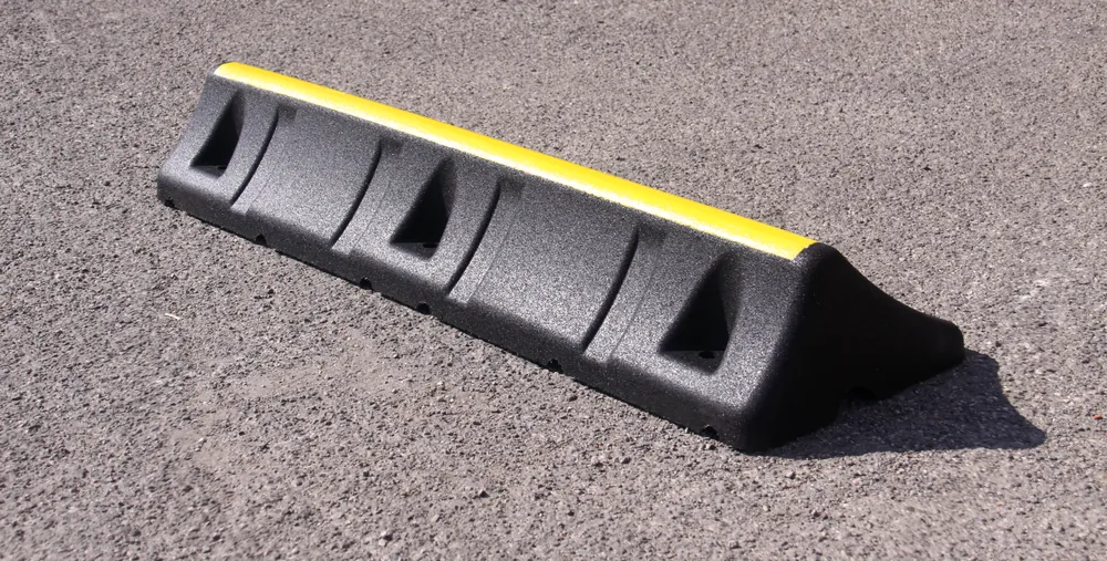 ECO-TRUCK STOP wheel chock for heavy-duty vehicles, shown in perspective on asphalt